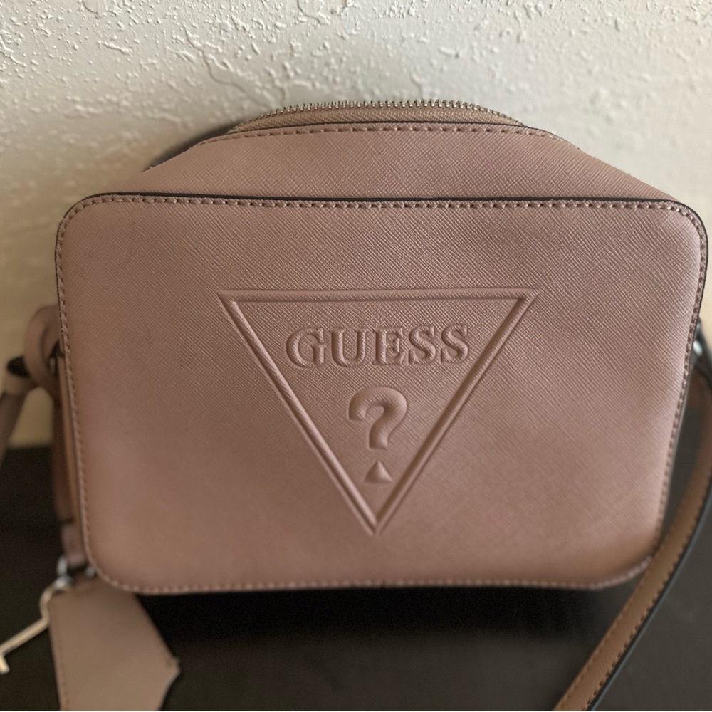 Blush small crossbody purse by Guess.